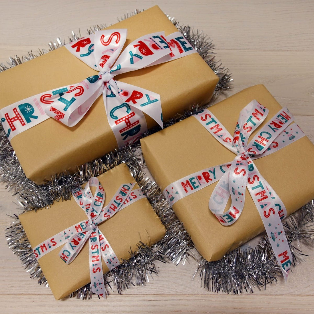 Trimits Ribbon Christmas Satin Ribbon: Merry Christmas: 16mm wide. Price per metre. - The Sewing Studio