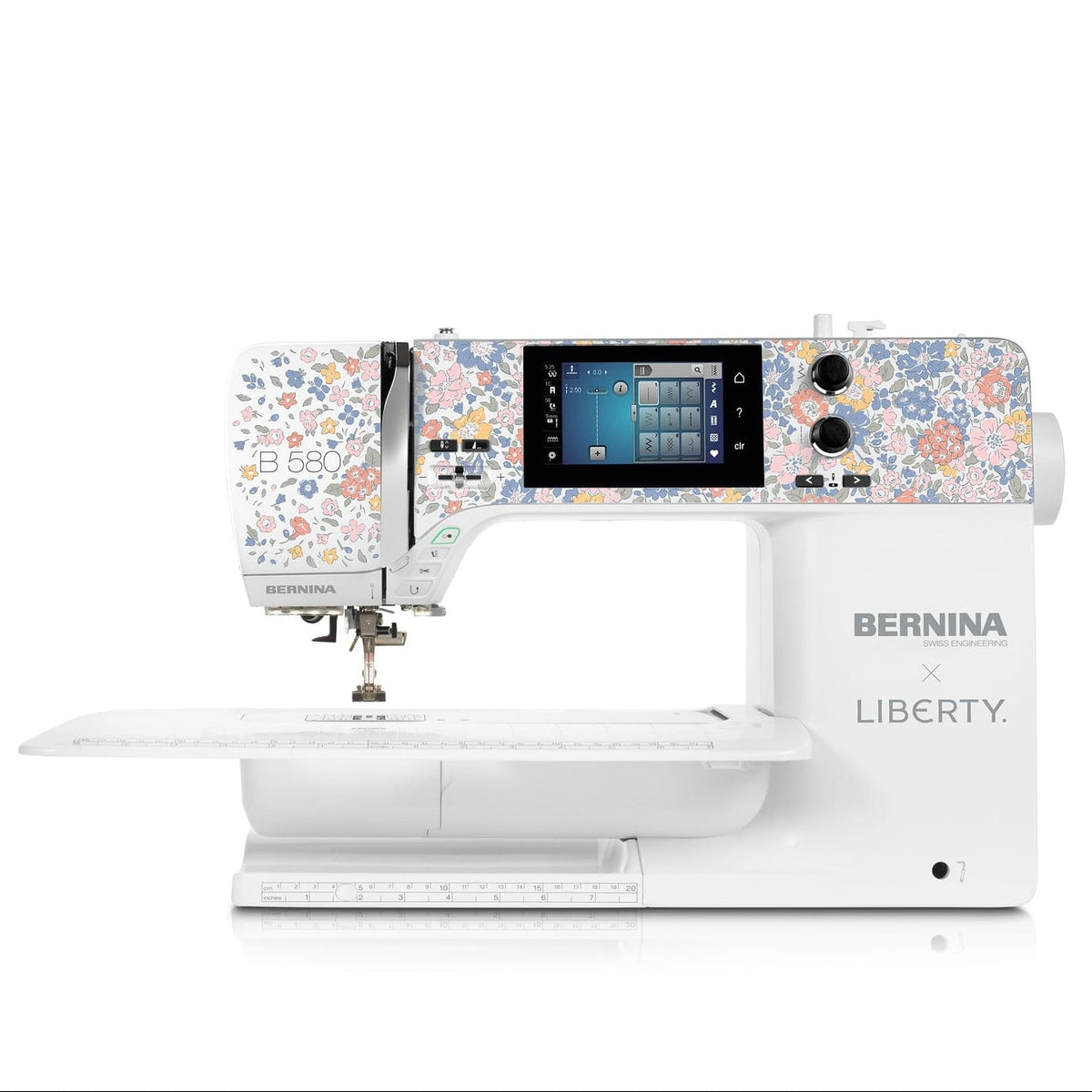 A BERNINA x LIBERTY sewing machine in white with a colorful floral pattern on the upper housing, shown on a clean white background.