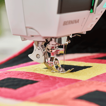 Bernina sewing machine on a colorful quilt