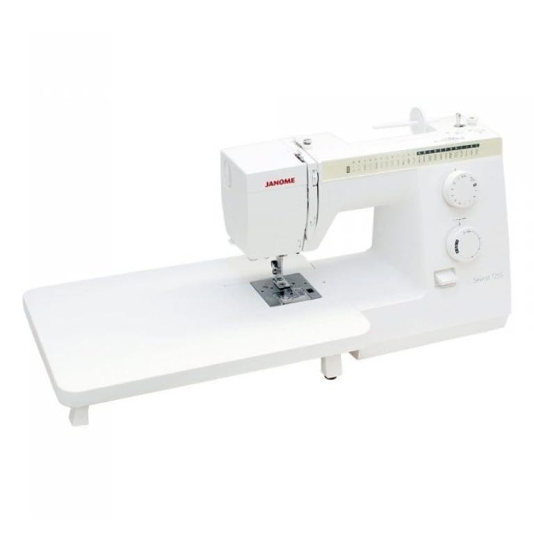 A white Janome sewing machine with an attached white straight-edge table base, shown from a three-quarters angle on a solid white background.