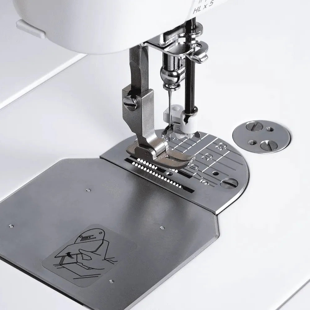 Sewing machine attachment on a white background