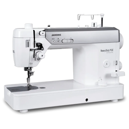 A Janome Heavy Duty 90C sewing machine in white and silver, shown from a three-quarter angle on a clean white background.