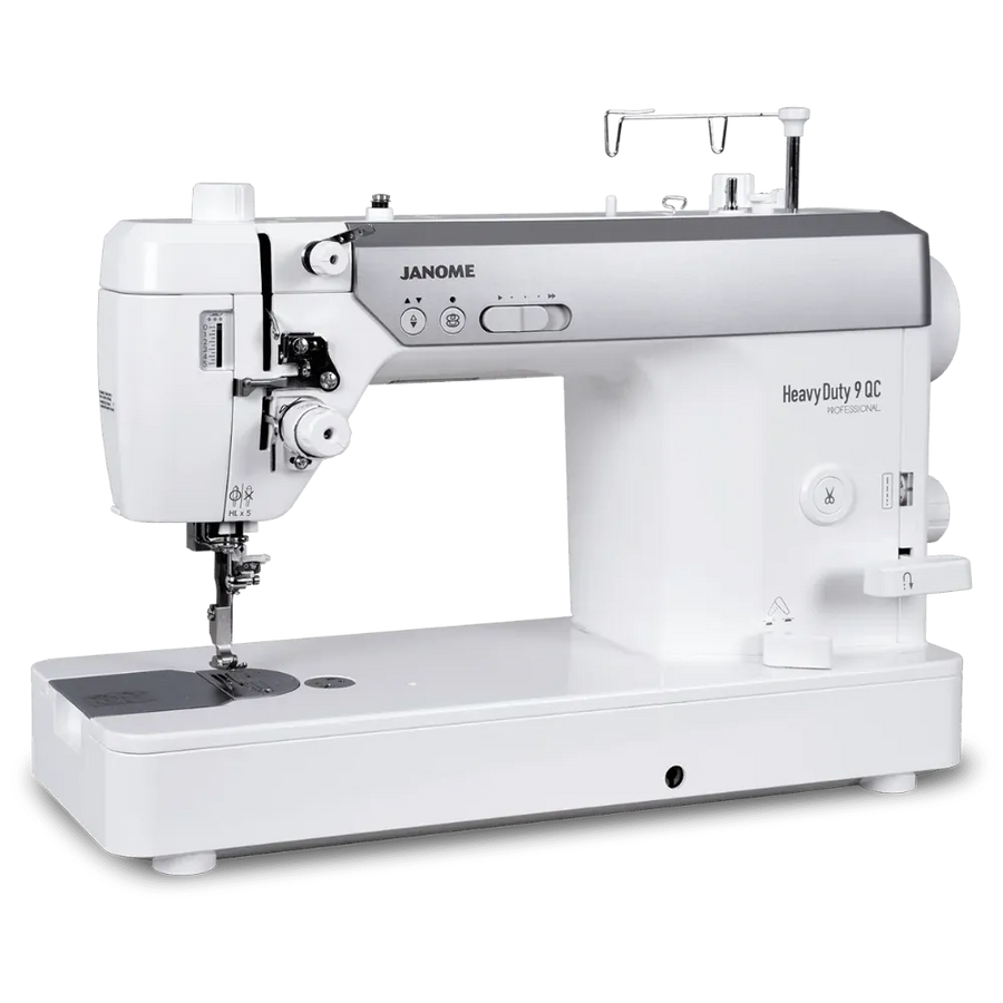 A Janome Heavy Duty 90C sewing machine in white and silver, shown from a three-quarter angle on a clean white background.