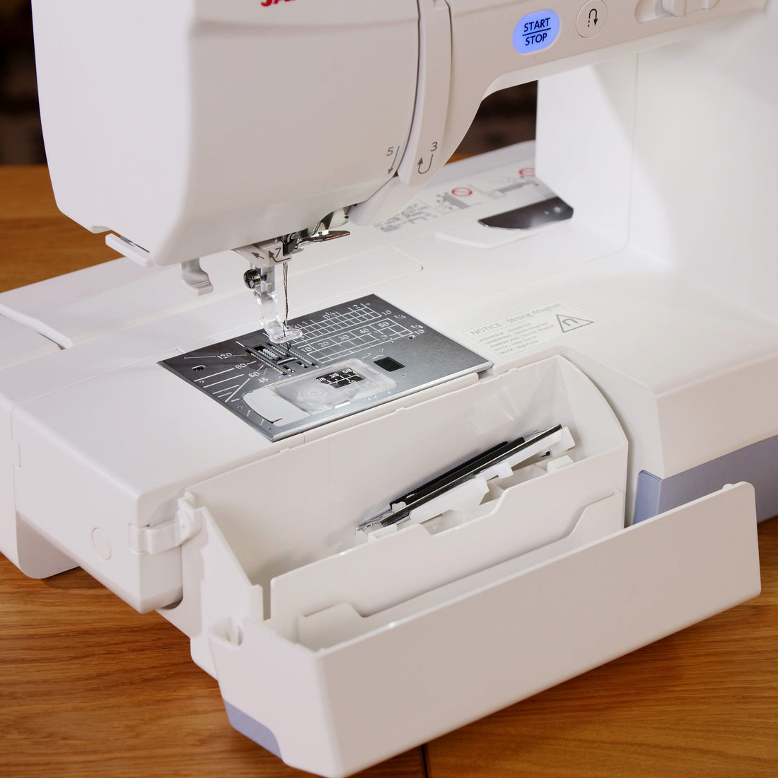 Janome Sewing Machines Janome Memory Craft 1000 Sewing and Embroidery Machine  - The Sewing Studio