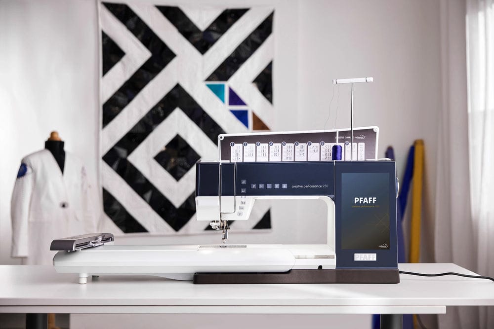 PFAFF sewing machine on a table with a decorative wall in the background