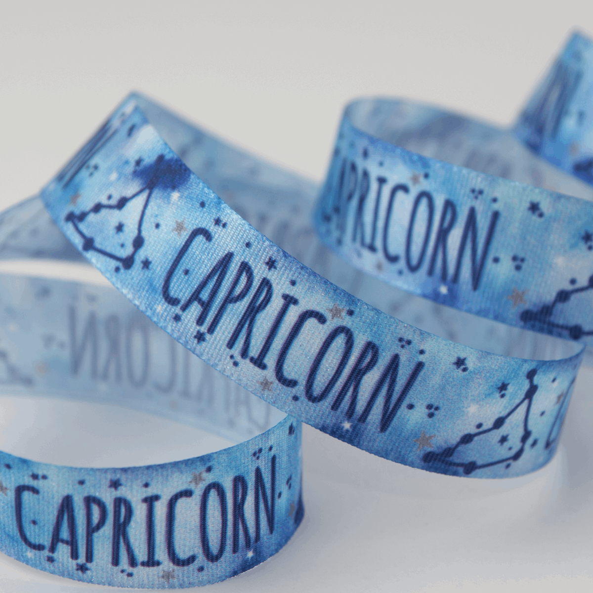 Berisfords Ribbon Zodiac Star Sign Ribbon: Capricorn: 15mm wide. Price per metre.  - The Sewing Studio